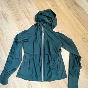 Blue rain jacket, all in motion, small